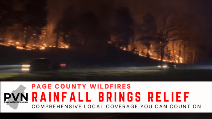 Page Valley News graphic. The hillside above US 211 west of Luray burns as cars drive by the wildfire on Friday night. Text reads "Page County Wildfires" "Rainfall brings relief" and "Comprehensive local coverage you can count on"